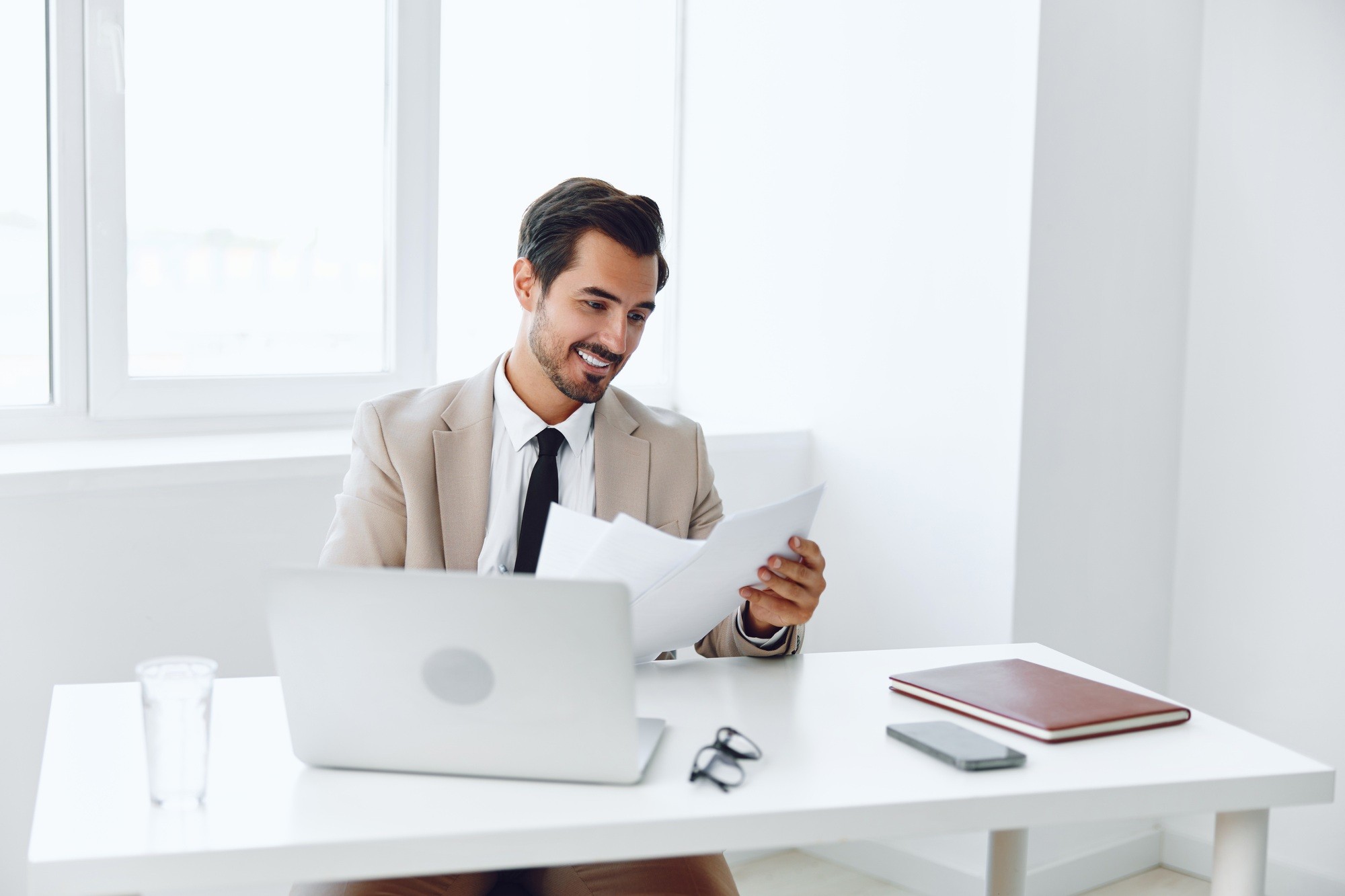 Laptop holding businessman happy company office positive planning paper suit document